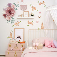 blush paper flowers with sage leaves paper flower wall decor in girls bedroom above cot