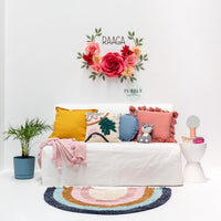 giant paper flower nursery decor above bed