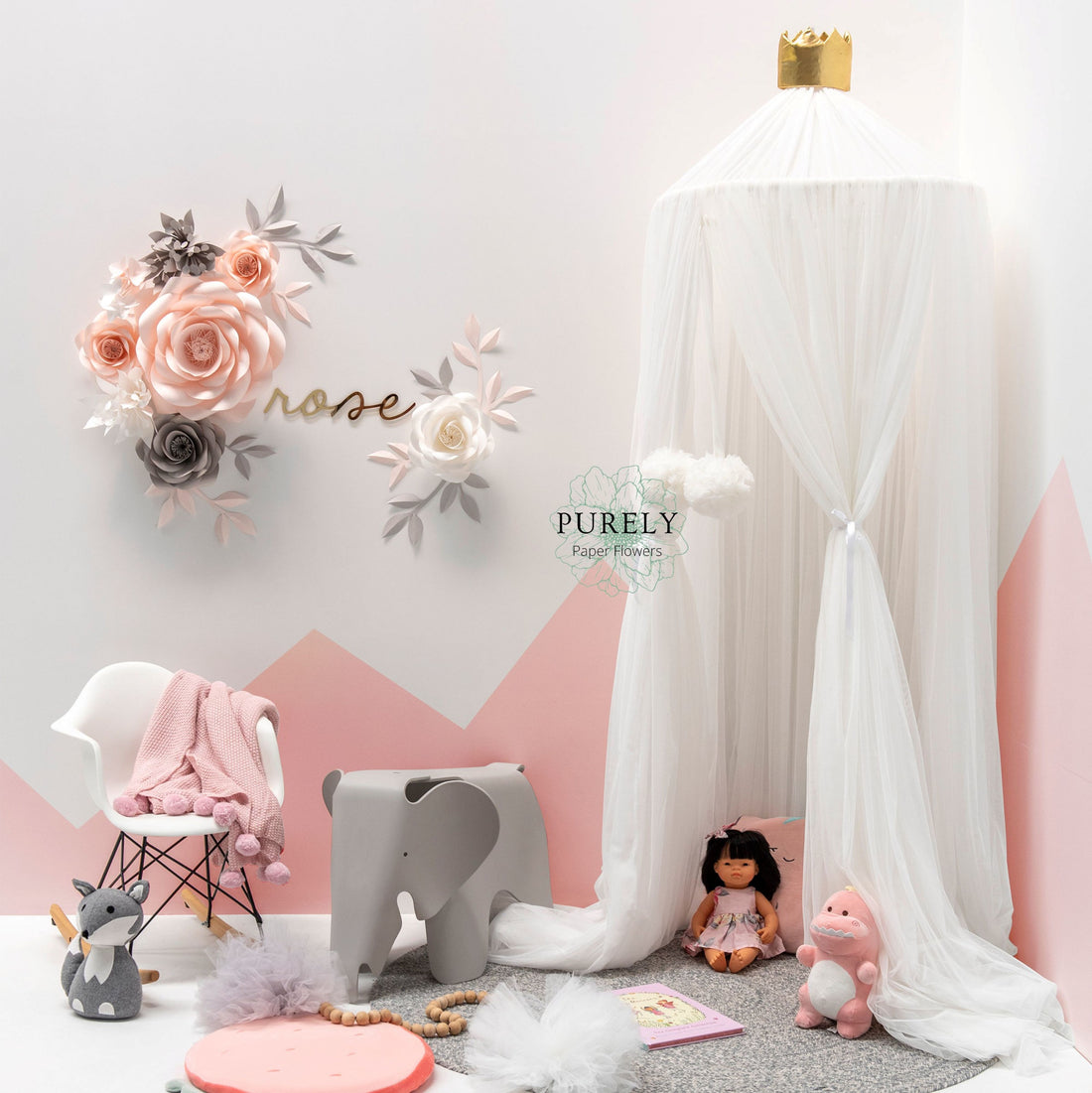 girl nursery paper flowers arrangement near spinkie baby canopy