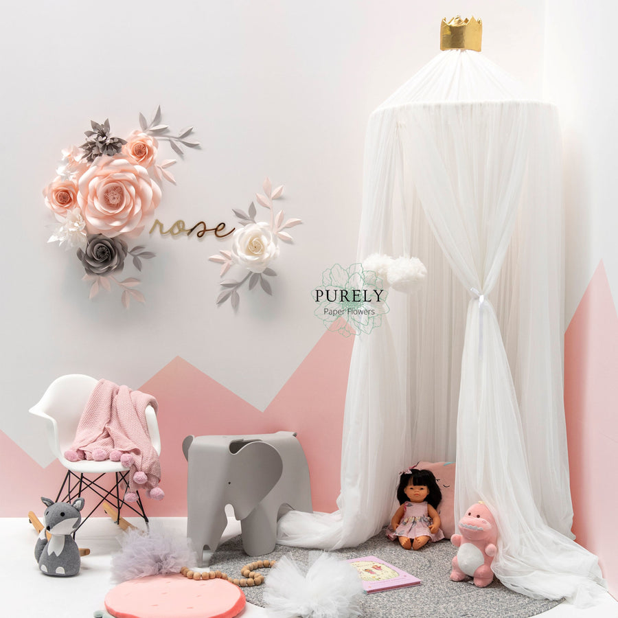 girl nursery paper flowers arrangement near spinkie baby canopy